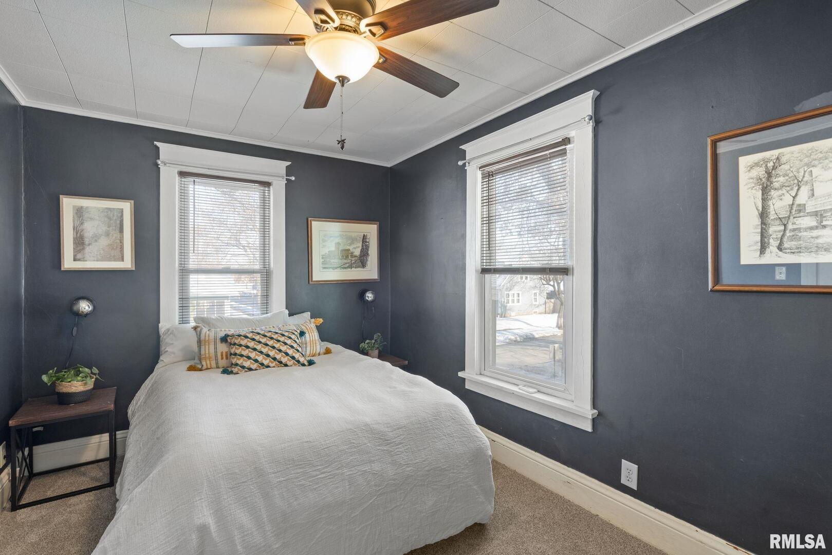 1602 37th Street Rock Island, IL 61201 - Photo 13 of 37 a bedroom with a bed and a window