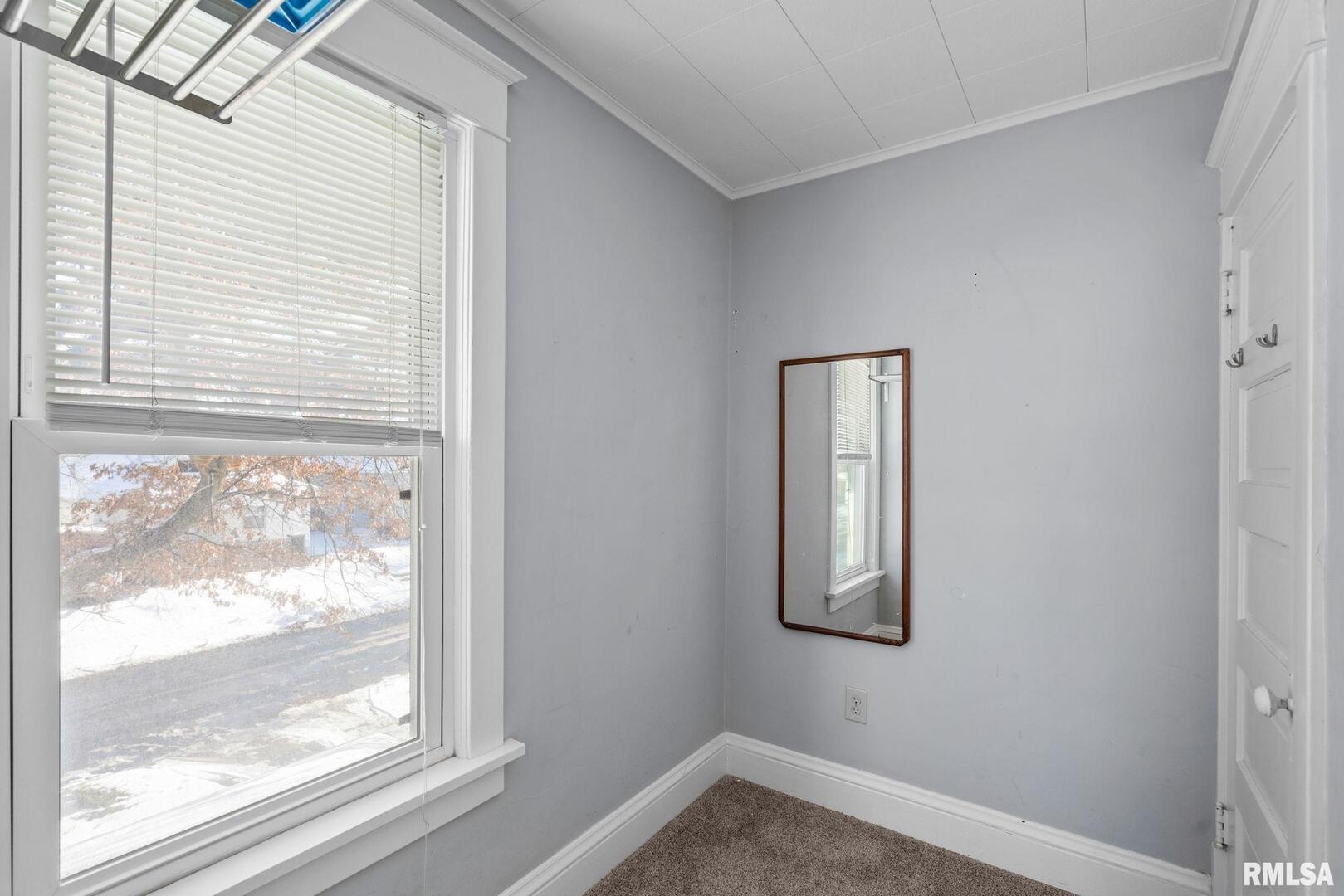 1602 37th Street Rock Island, IL 61201 - Photo 15 of 37 a view of a small space with wooden floor and a window