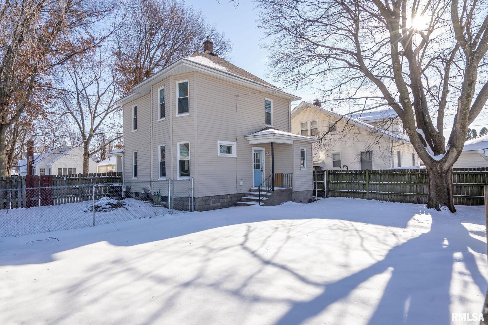 1602 37th Street Rock Island, IL 61201 - Photo 32 of 37 a view of house with a yard covered in snow
