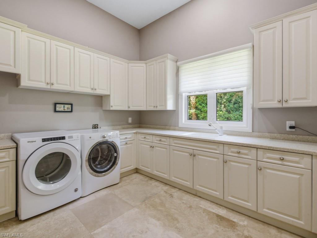7051 Hunters Road Naples, FL 34109 - Photo 19 of 49 a utility room with sink dryer and washer