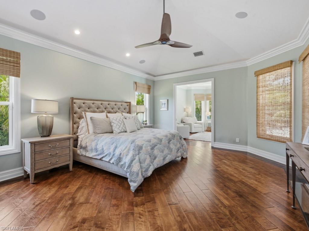 7051 Hunters Road Naples, FL 34109 - Photo 20 of 49 a bedroom with a bed and window