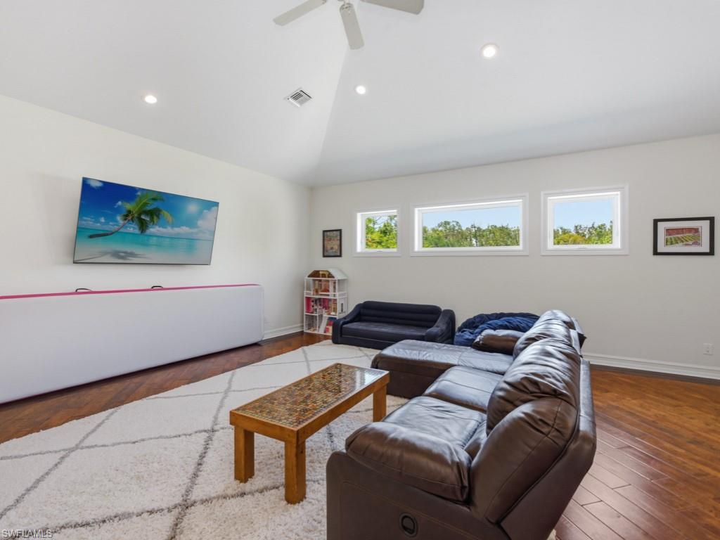 7051 Hunters Road Naples, FL 34109 - Photo 26 of 49 a living room with furniture and window