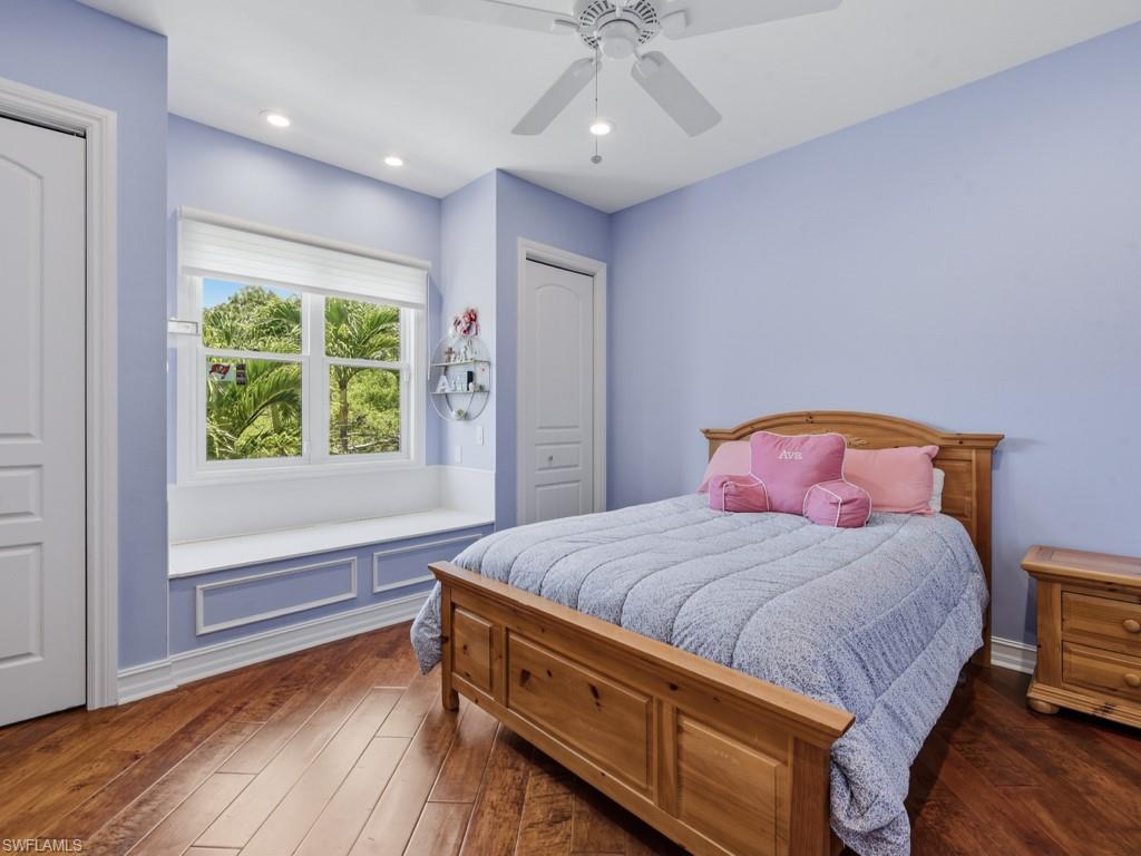 7051 Hunters Road Naples, FL 34109 - Photo 29 of 49 a bedroom with a bed and a window