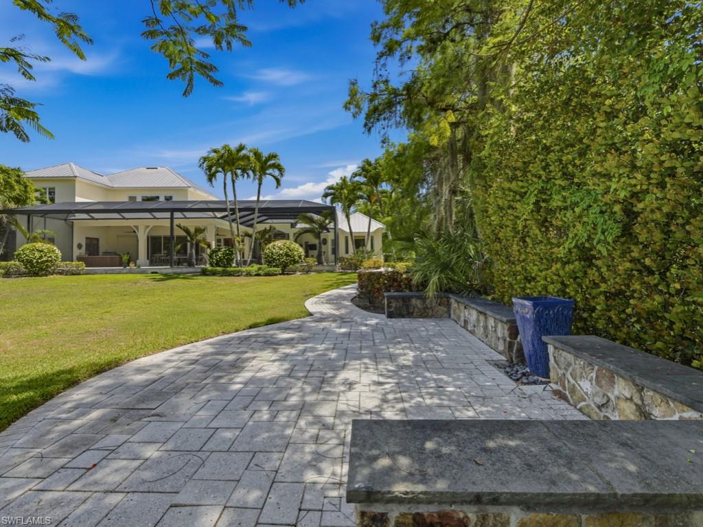 7051 Hunters Road Naples, FL 34109 - Photo 42 of 49 a view of a volley ball court