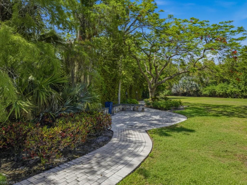 7051 Hunters Road Naples, FL 34109 - Photo 43 of 49 a view of a yard with plants