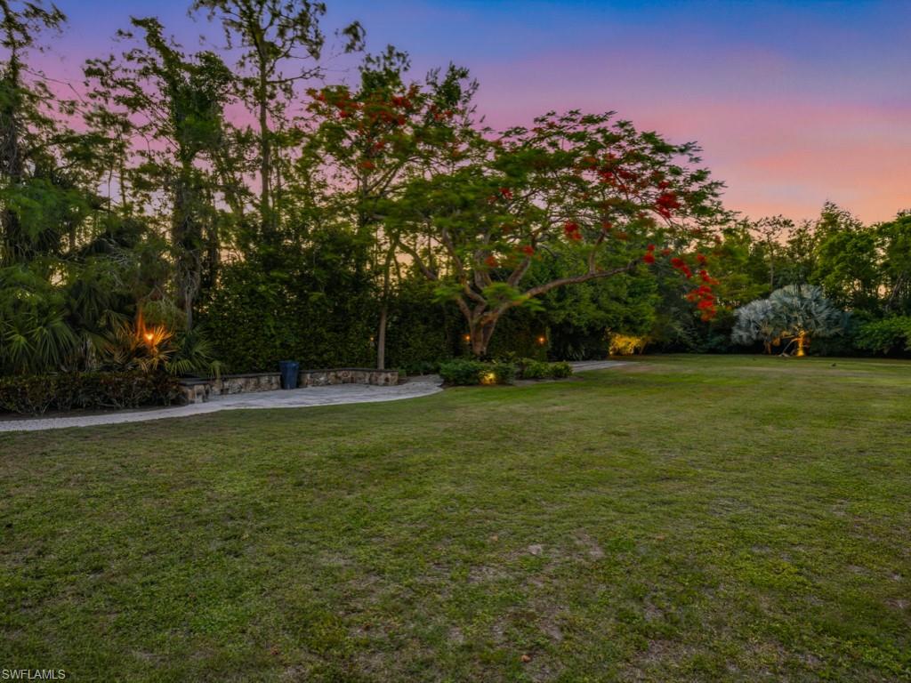 7051 Hunters Road Naples, FL 34109 - Photo 44 of 49 a view of a field with trees