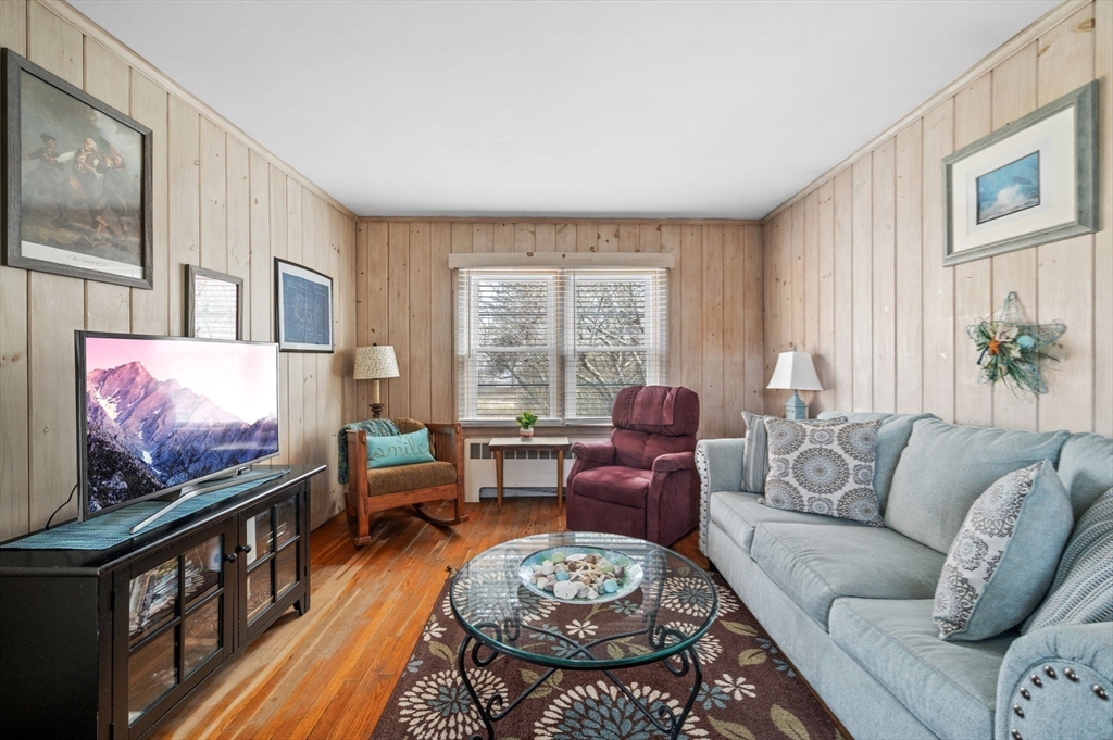 19-21 Cleveland Road Marblehead, MA 01945 - Photo 13 of 35 a living room with furniture and a flat screen tv