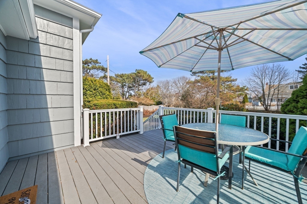 19-21 Cleveland Road Marblehead, MA 01945 - Photo 25 of 35 a view of a roof deck with table and chairs