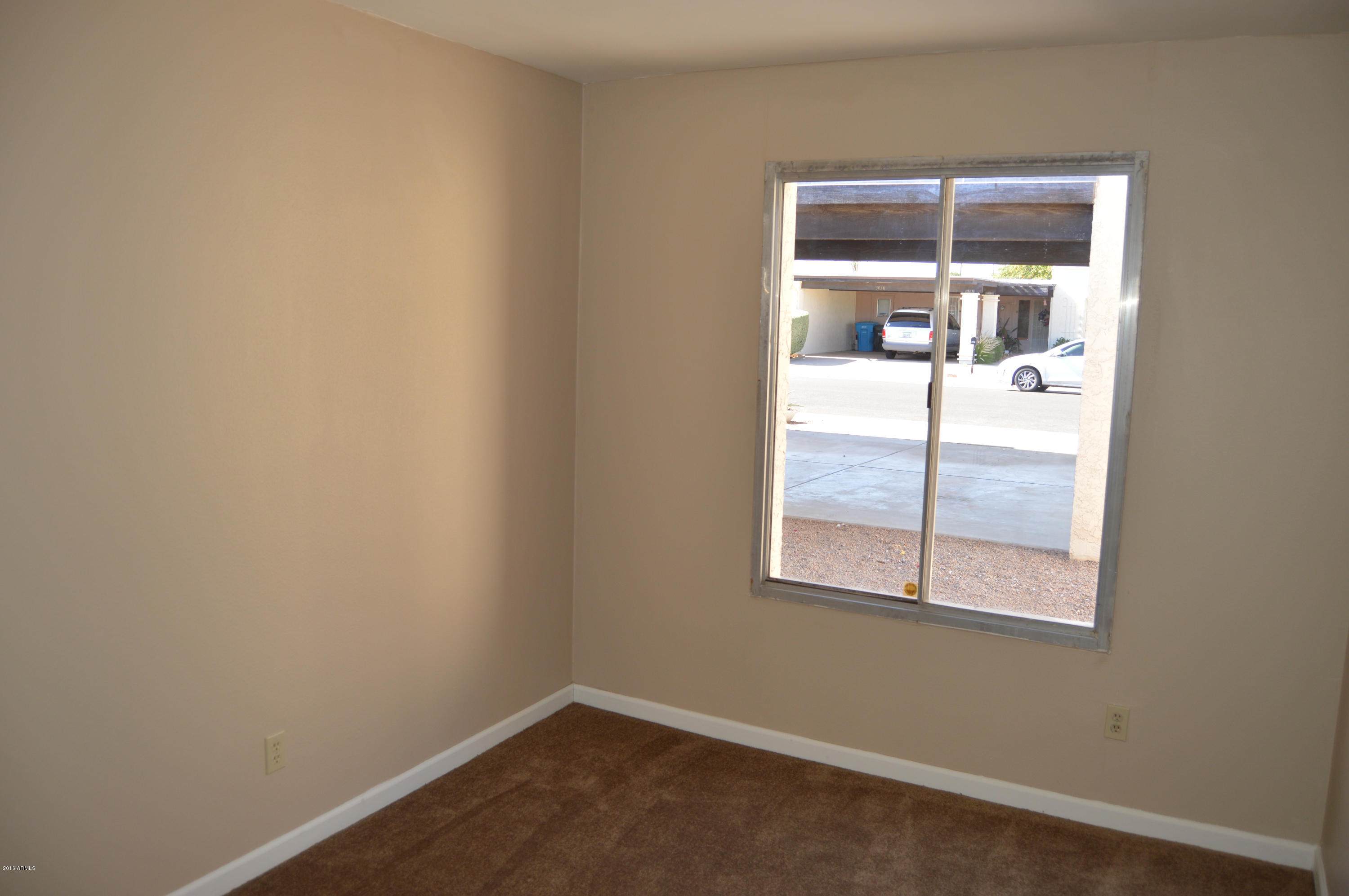 3029 West Redfield Road Phoenix, AZ 85053 - Photo 17 of 21 an empty room with a window