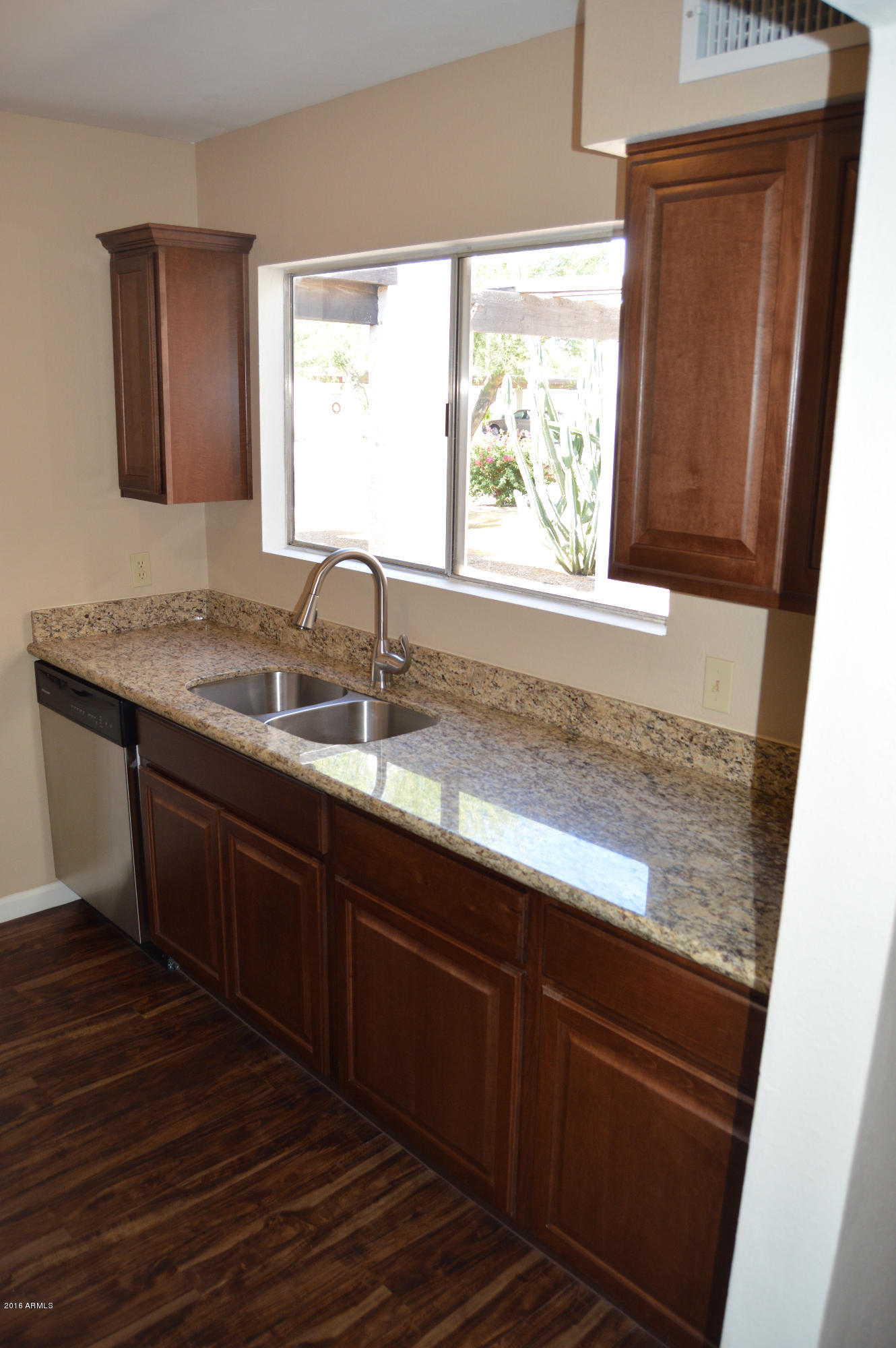 3029 West Redfield Road Phoenix, AZ 85053 - Photo 8 of 21 a sink with wooden floor