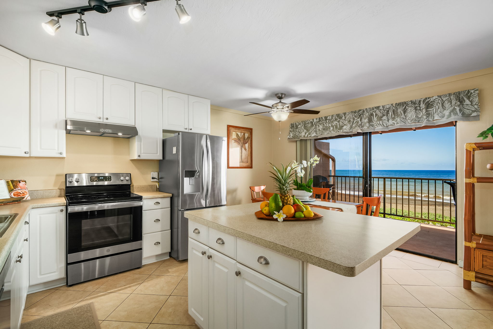 4451 Moana Road, Unit 309 Waimea, HI 96796 - Photo 2 of 21 a kitchen with a sink appliances and cabinets