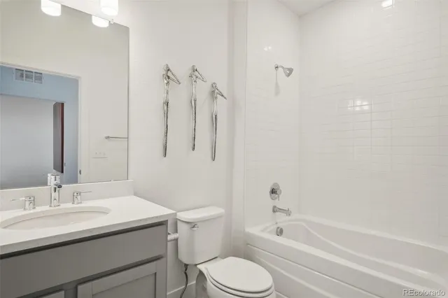 a bathroom with a sink toilet and bathtub