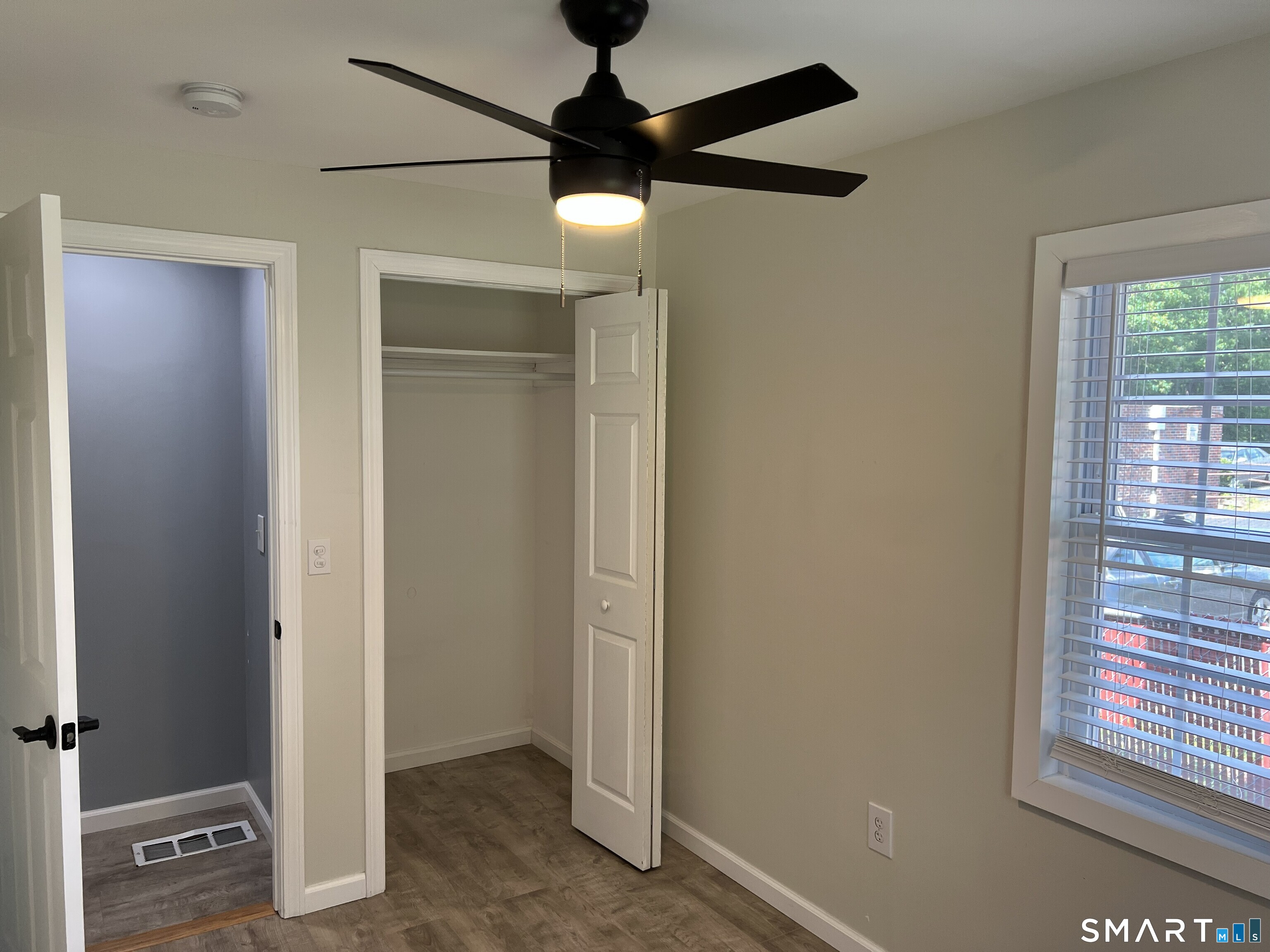 82 Bingham Street Bristol, CT 06010 - Photo 26 of 40 an empty room with windows and fan