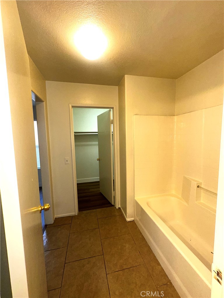 14413 Stivers Road Victorville, CA 92394 - Photo 6 of 17 a bathroom with a bathtub and shower