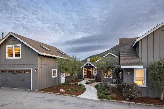 a front view of a house with garden