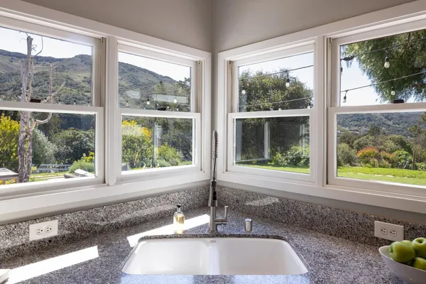 a view of a sink and a window