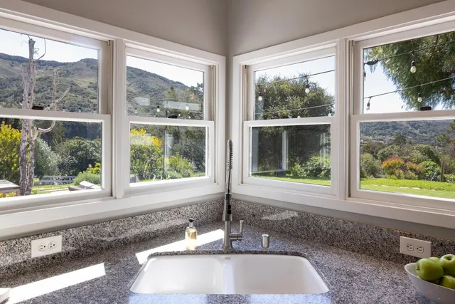 a view of a sink and a window