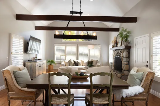 a view of a dining room with furniture window and outside view