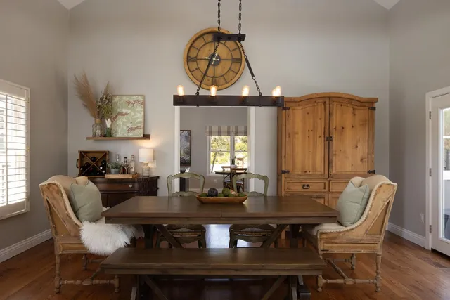 a view of a dining room with furniture window and wooden floor