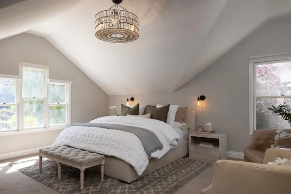 a bedroom with a bed and window