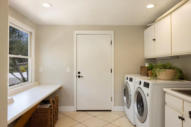 a view of a kitchen with washer and dryer