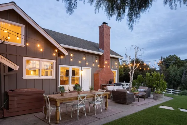 a view of a patio with couches and table and chairs