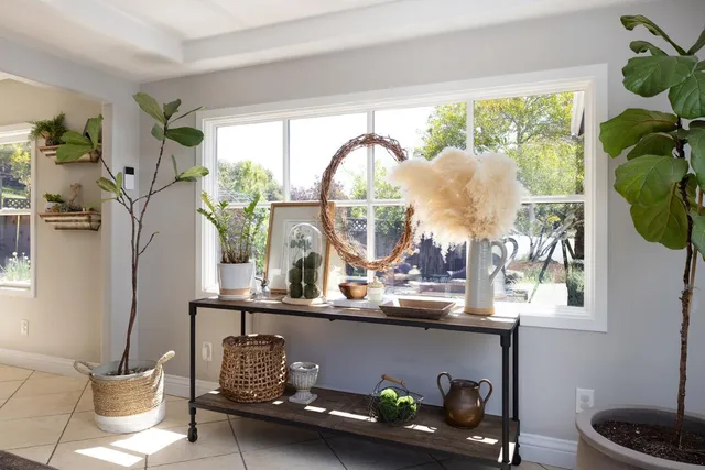 a dining room with furniture and a window