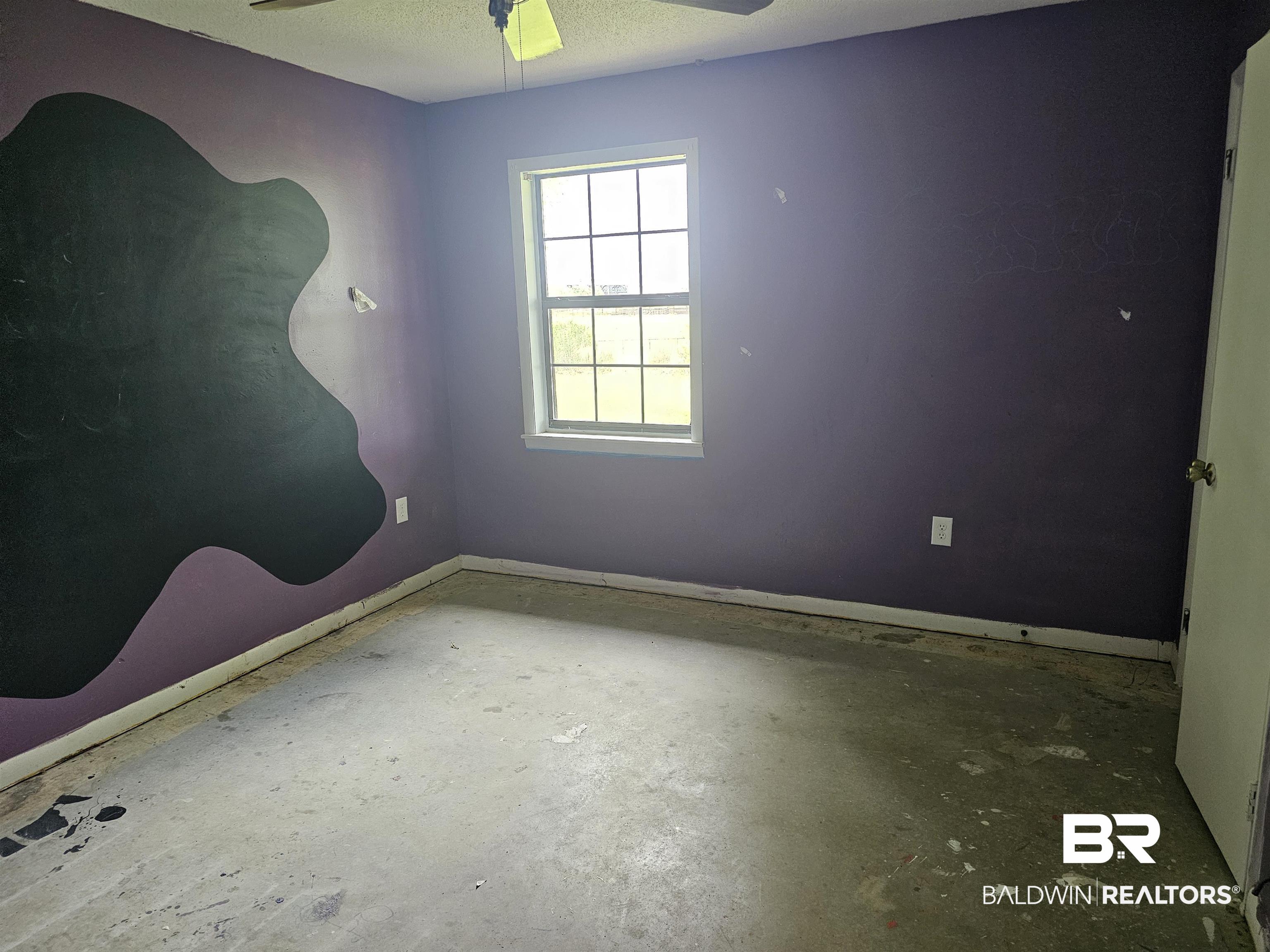 59575 Lottie Road Atmore, AL 36502 - Photo 16 of 23 Unfurnished room featuring concrete floors, baseboards, and a ceiling fan