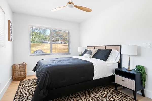 a bedroom with a bed and a couch