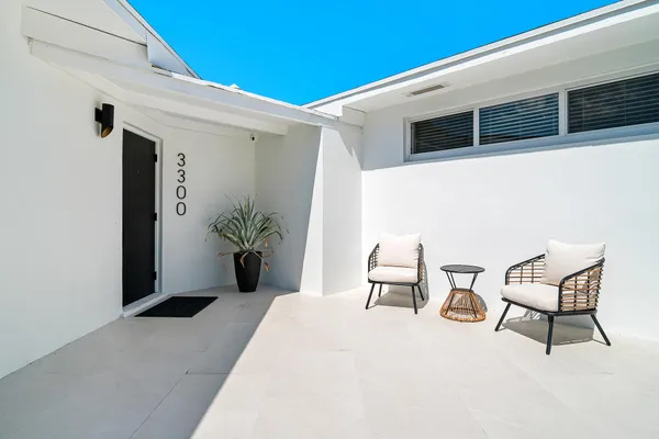 a outdoor space with a couch and a chair