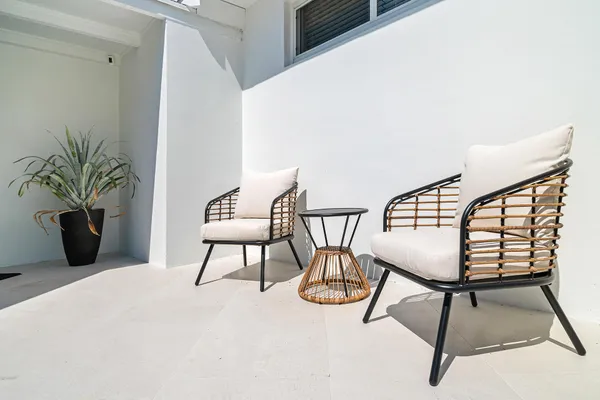 a view of a livingroom with furniture and a potted plant