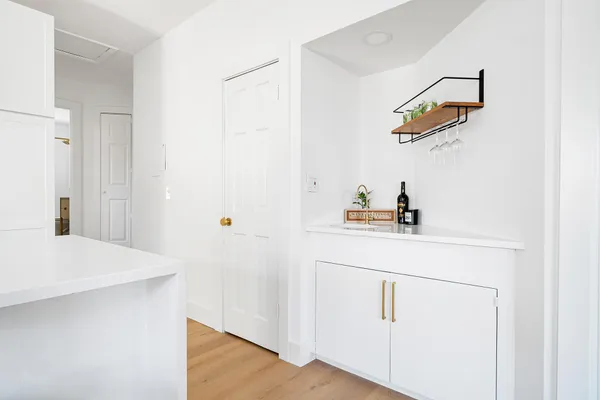 a room with a sink and a mirror