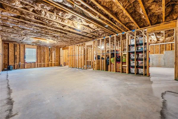 a view of an empty room with a garage