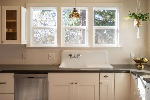 a kitchen with a sink and a window