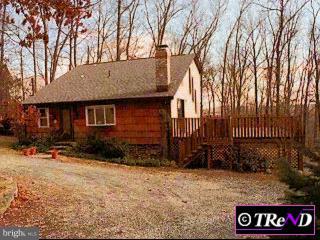 560 Pine Swamp Road Elverson, PA 19520 - Photo 1 of 1 a front view of a house with a yard