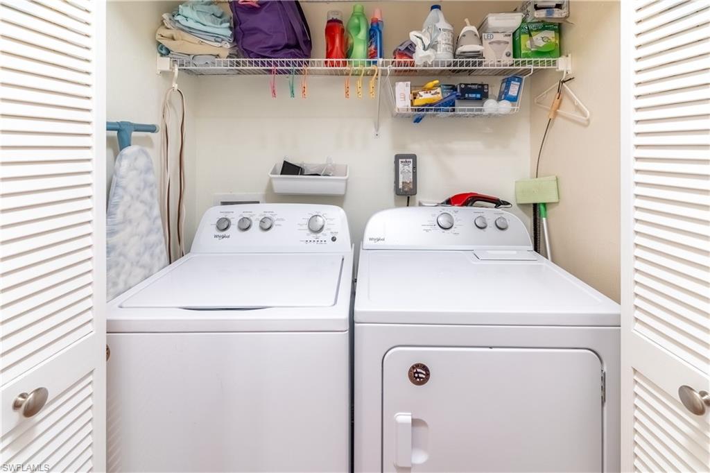 522 Beachwalk Circle Naples, FL 34108 - Photo 27 of 34 a utility room with dryer and washer