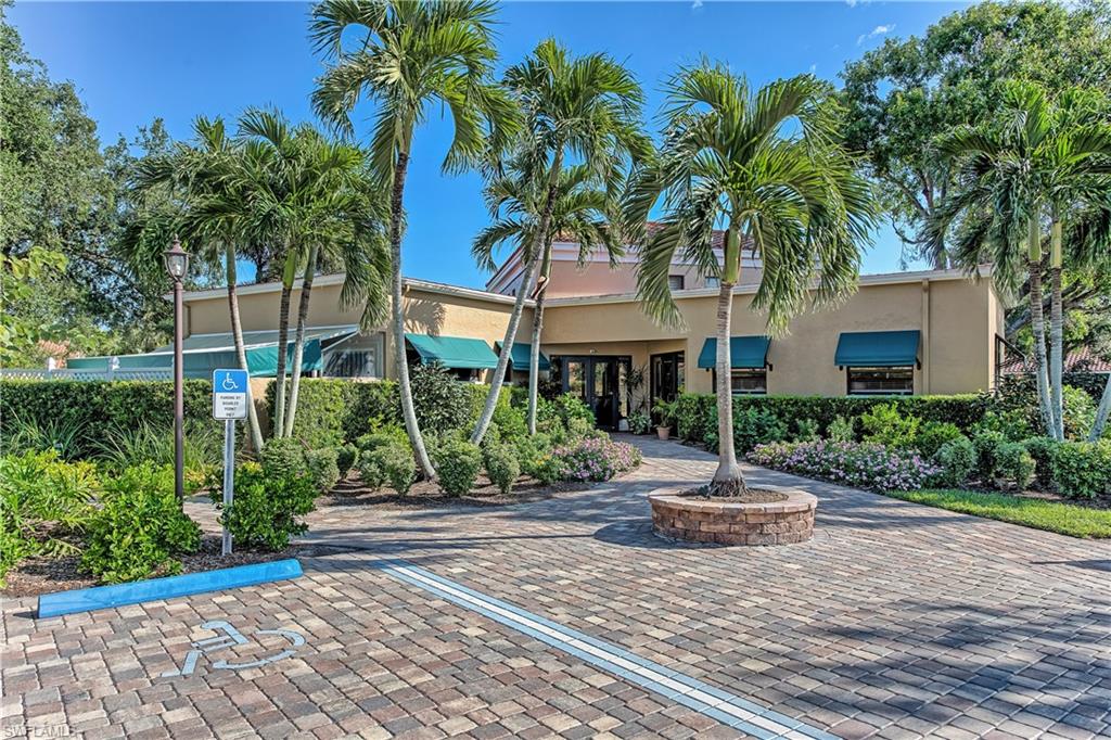 522 Beachwalk Circle Naples, FL 34108 - Photo 31 of 34 a front view of a house with garden