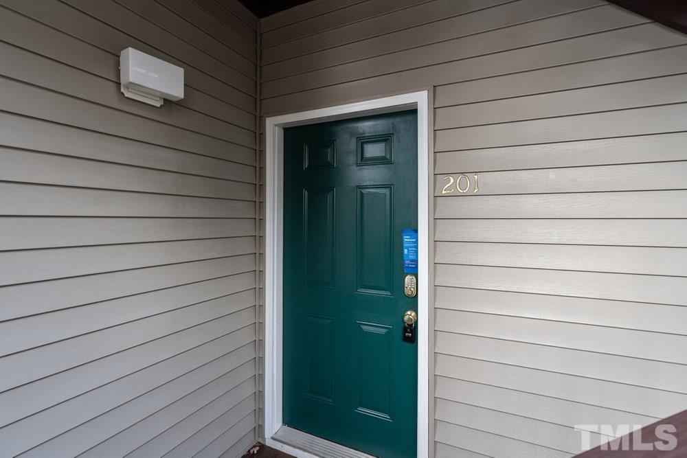 7022 Sandy Forks Road, Unit 201 Raleigh, NC 27615 - Photo 2 of 30 a view of door