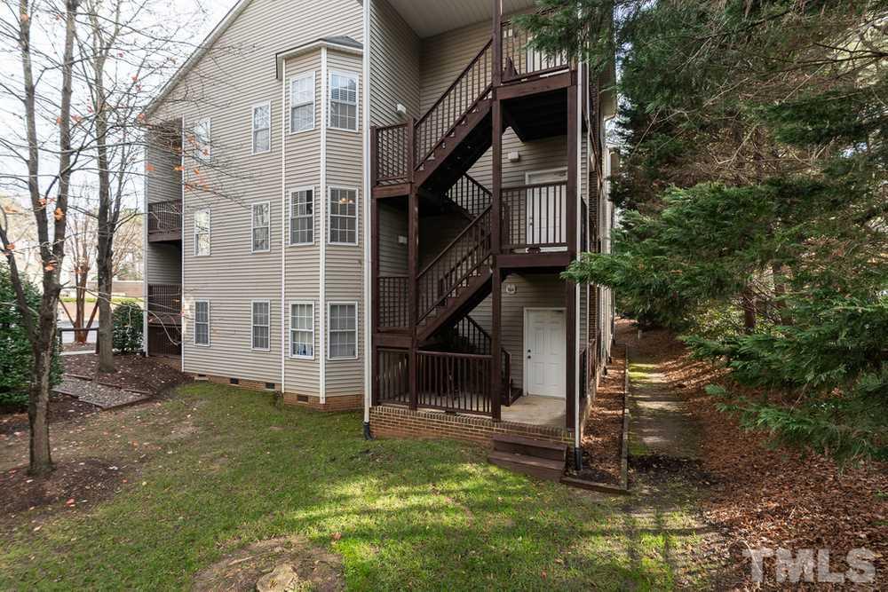 7022 Sandy Forks Road, Unit 201 Raleigh, NC 27615 - Photo 30 of 30 front view of a house with a yard