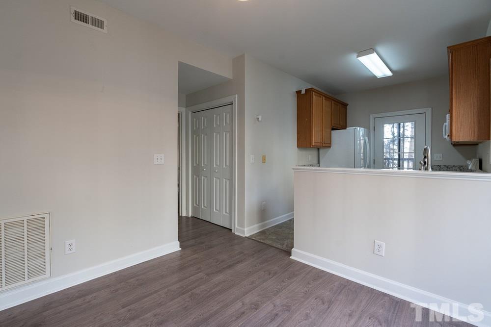 7022 Sandy Forks Road, Unit 201 Raleigh, NC 27615 - Photo 9 of 30 a view of a kitchen from the hallway