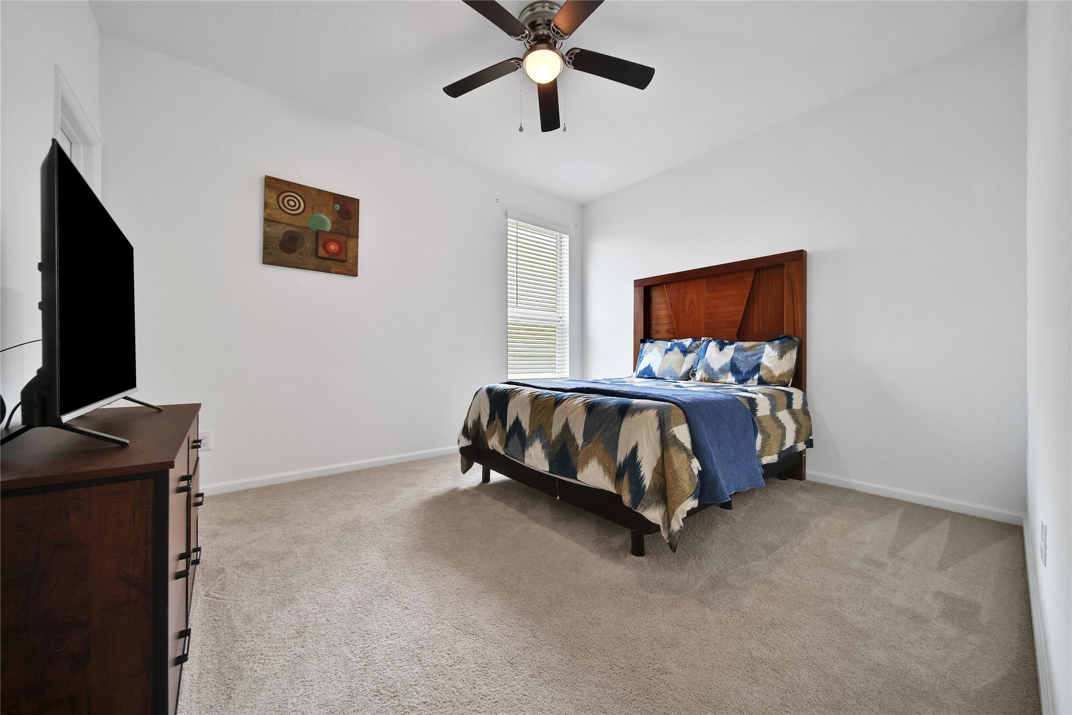 3707 Meadow Breeze Lane Rosenberg, TX 77469 - Photo 13 of 30 a bed room with a bed and a flat screen tv