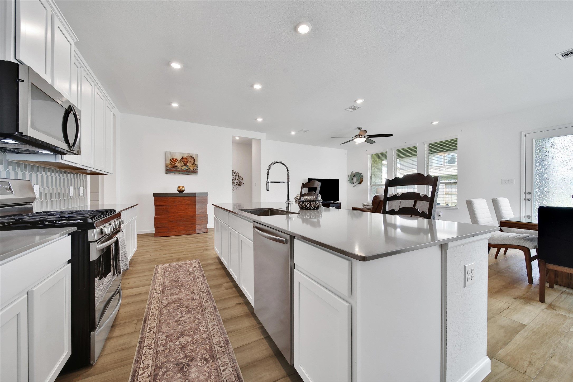 3707 Meadow Breeze Lane Rosenberg, TX 77469 - Photo 17 of 30 a kitchen with stainless steel appliances granite countertop a sink and cabinets