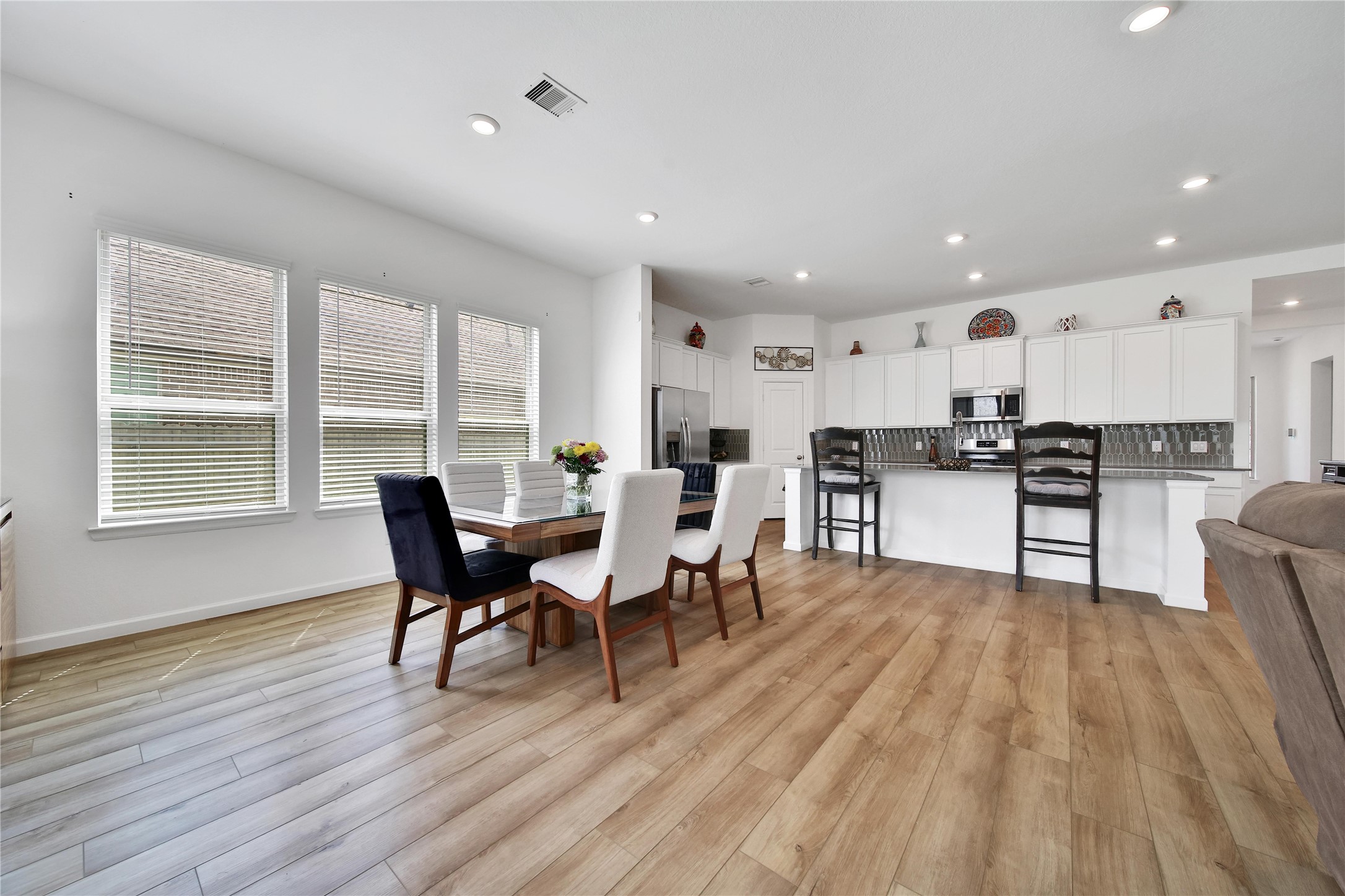 3707 Meadow Breeze Lane Rosenberg, TX 77469 - Photo 19 of 30 a view of a dining room with furniture window and wooden floor