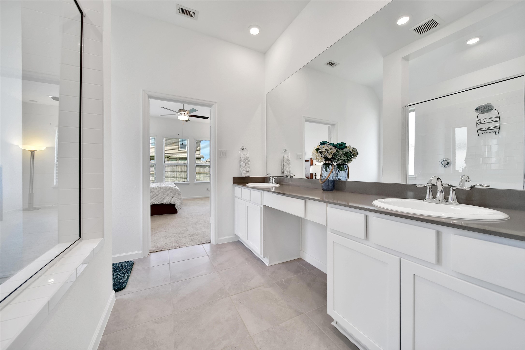 3707 Meadow Breeze Lane Rosenberg, TX 77469 - Photo 24 of 30 a bathroom with a sink double vanity and a mirror