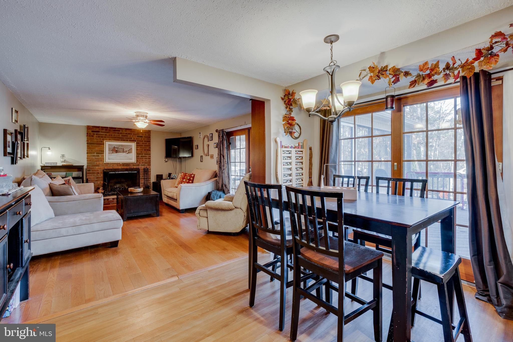 572 Fairview Road Medford, NJ 08055 - Photo 13 of 48 a view of a dining room with furniture window and wooden floor
