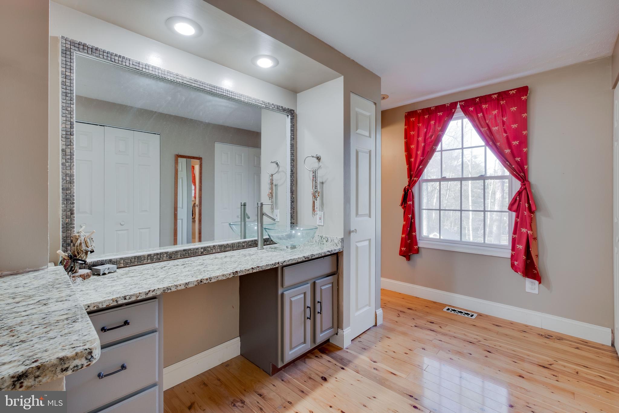 572 Fairview Road Medford, NJ 08055 - Photo 24 of 48 a spacious bathroom with a granite countertop tub sink and mirror