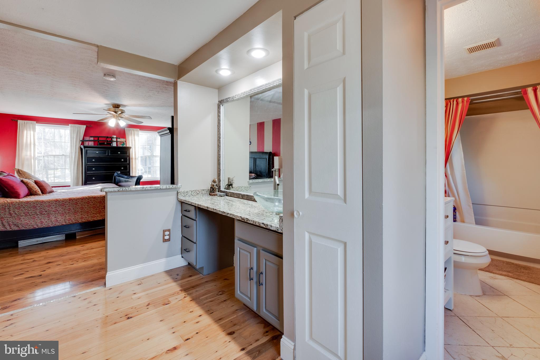 572 Fairview Road Medford, NJ 08055 - Photo 25 of 48 a view of living room kitchen with stainless steel appliances granite countertop cabinets and fireplace