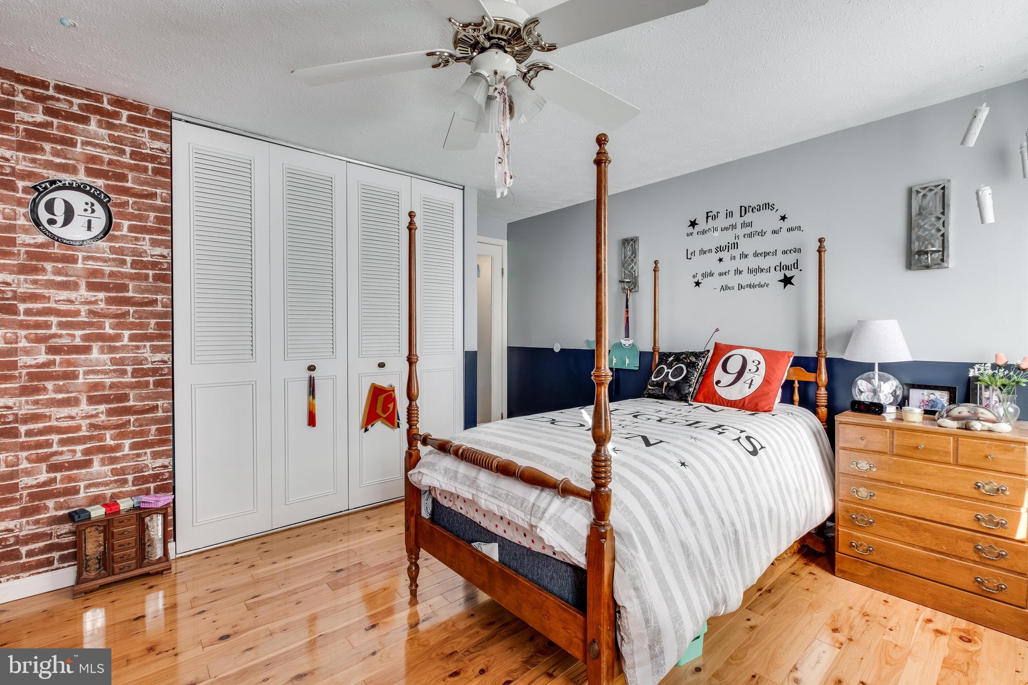 572 Fairview Road Medford, NJ 08055 - Photo 27 of 48 a bedroom with a bed and a chandelier