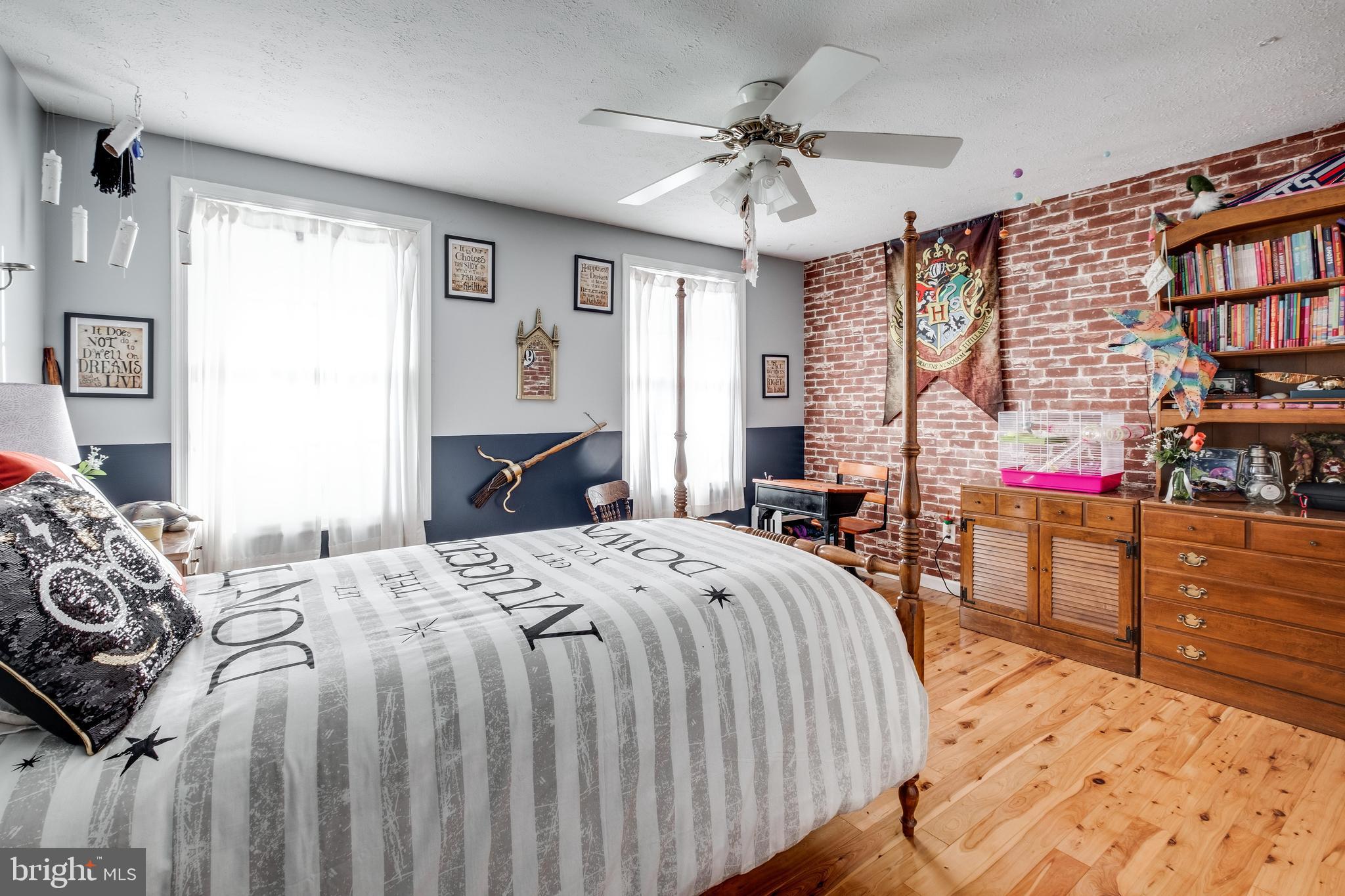 572 Fairview Road Medford, NJ 08055 - Photo 28 of 48 a bedroom with a large bed and a chandelier