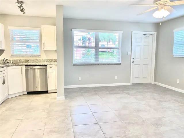 a view of a kitchen with an oven and cabinets